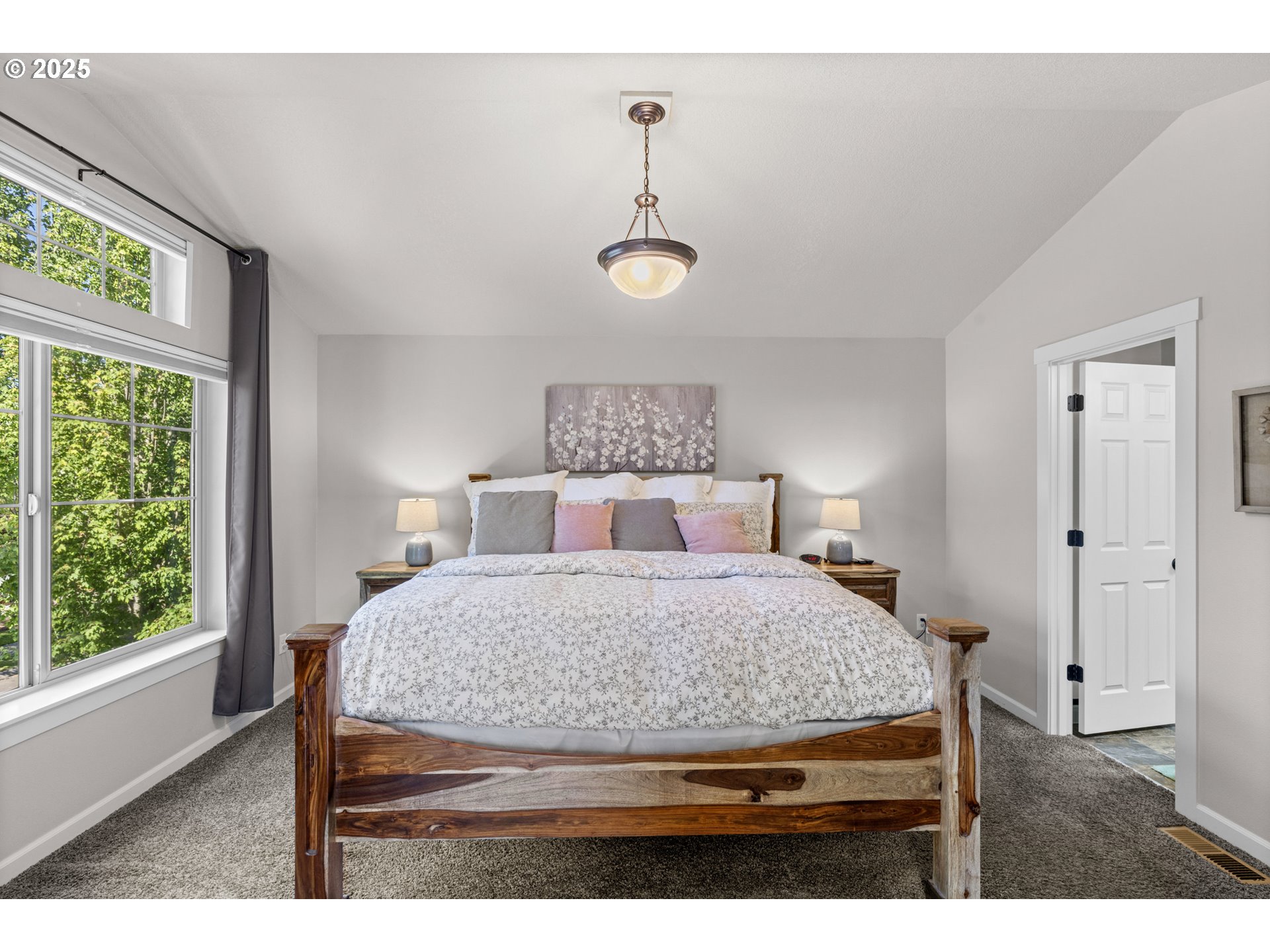 113 Northwest 76th Street Vancouver, WA 98665 - Photo 22 of 33 a bedroom with a bed and windows