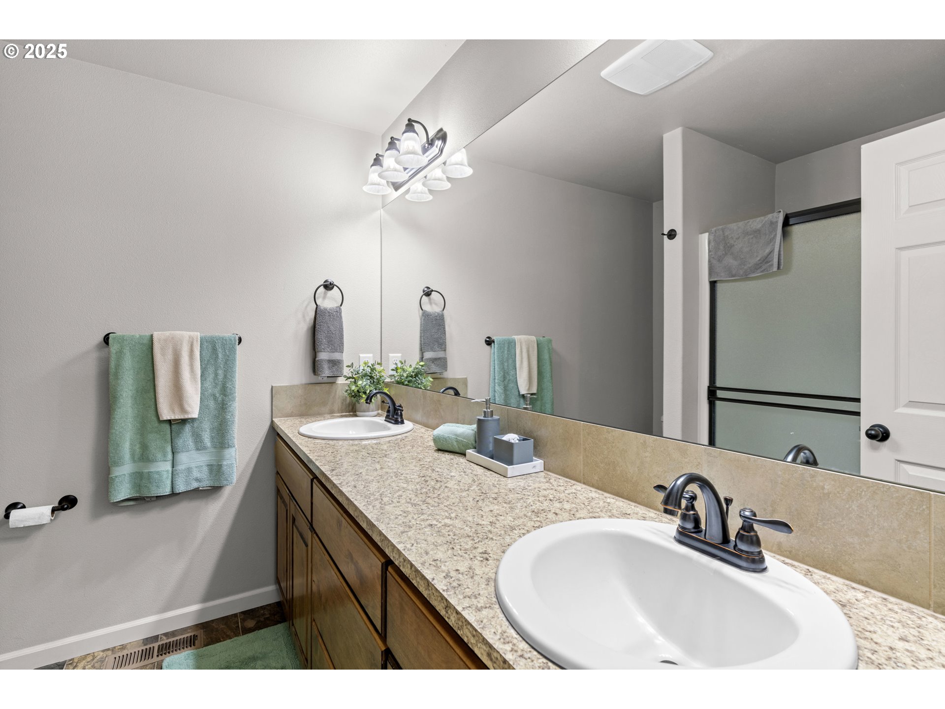 113 Northwest 76th Street Vancouver, WA 98665 - Photo 25 of 33 a bathroom with a sink double vanity granite and a mirror