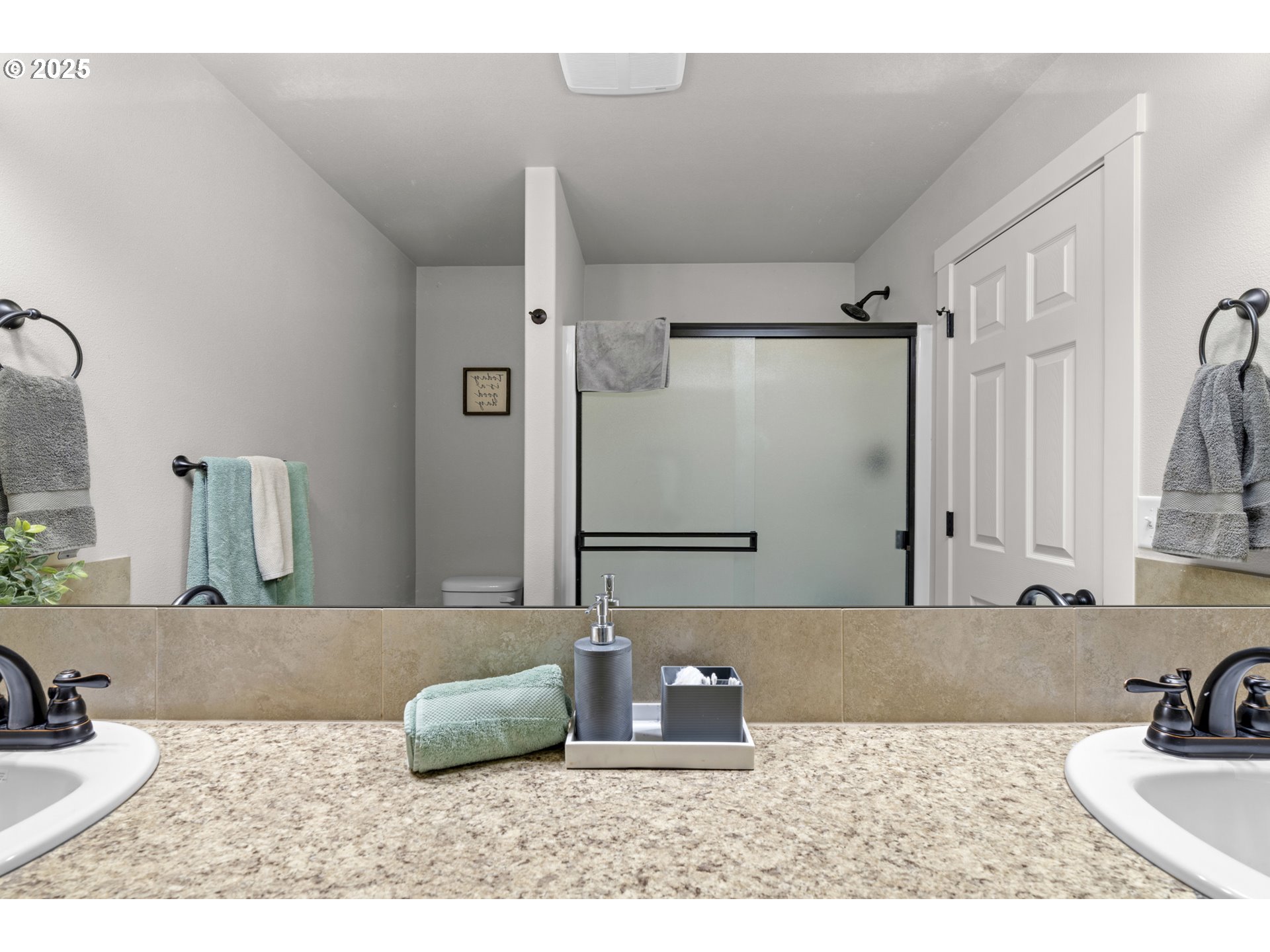 113 Northwest 76th Street Vancouver, WA 98665 - Photo 26 of 33 a bathroom with a granite countertop sink a mirror and shower