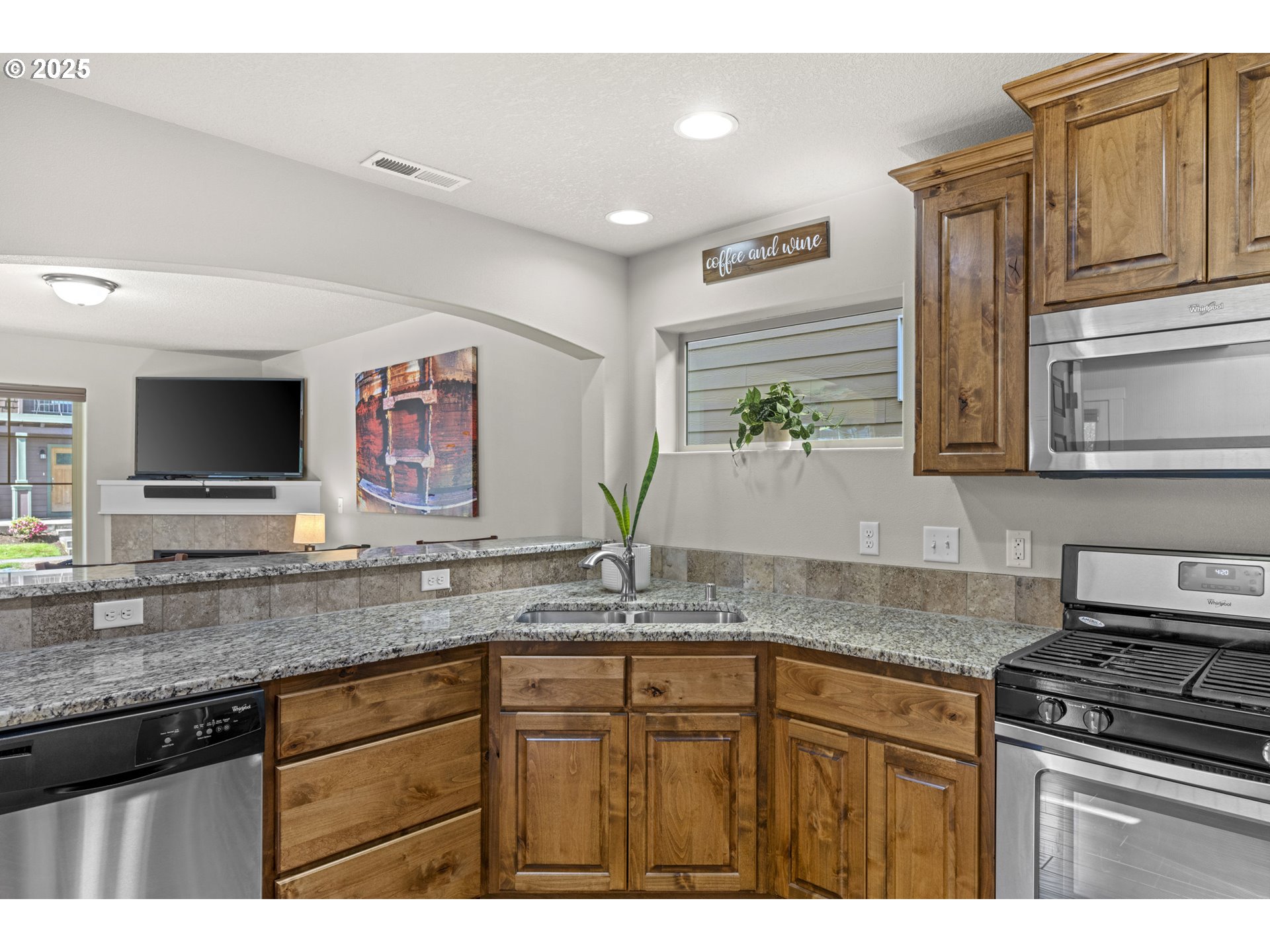 113 Northwest 76th Street Vancouver, WA 98665 - Photo 10 of 33 a kitchen with granite countertop a sink stainless steel appliances and cabinets