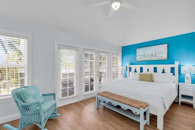 a view of a hallway with furniture and a potted plant
