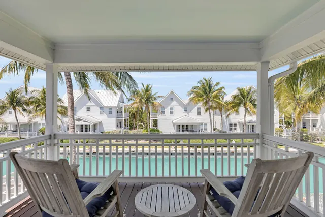 a bedroom with furniture and a flat screen tv