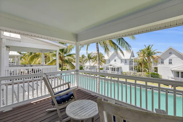 a view of a chair and table in the balcony