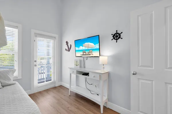 a bedroom with a bed and a dresser