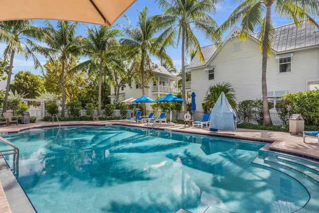 a view of kitchen with windows and cabinet