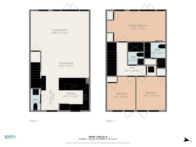 an aerial view of a city with lots of residential buildings ocean and mountain view in back