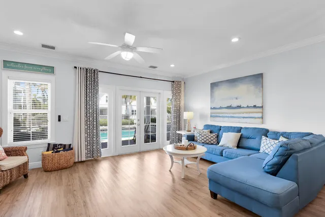 a view of a dining room with furniture wooden floor and chandelier