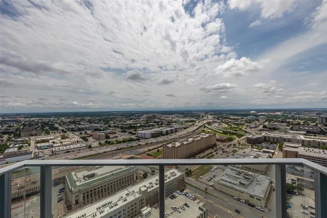 a view of a backyard with plants and a patio