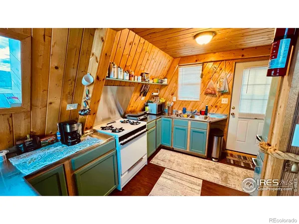 a black and white kitchen with stainless steel appliances