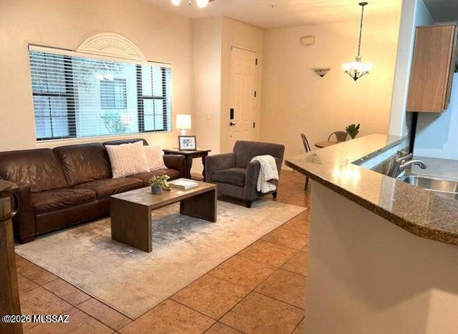 2018 East River Road, Unit 102 Tucson, AZ 85718 - Photo 5 of 25 a living room with furniture and a large window