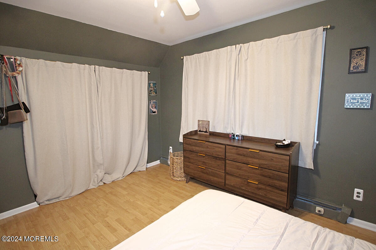 7 Taylor Road Matawan, NJ 07747 - Photo 15 of 33 a bedroom with a bed and a mirror