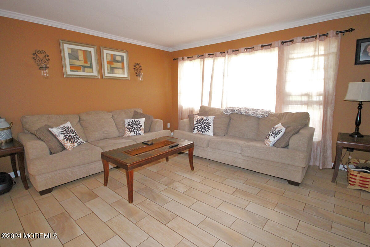 7 Taylor Road Matawan, NJ 07747 - Photo 2 of 33 a living room with furniture and a large window