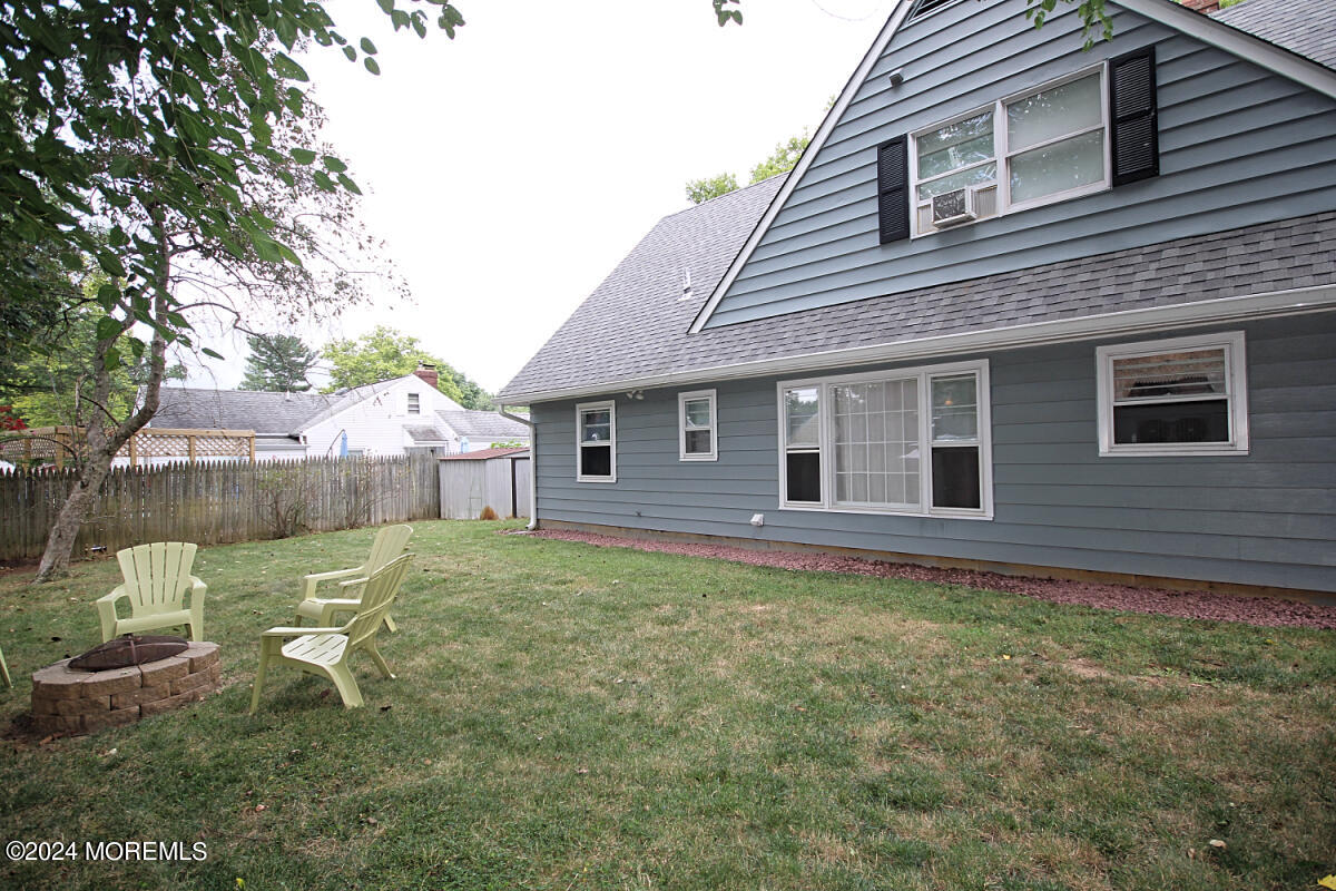 7 Taylor Road Matawan, NJ 07747 - Photo 24 of 33 a backyard of a house with table and chairs