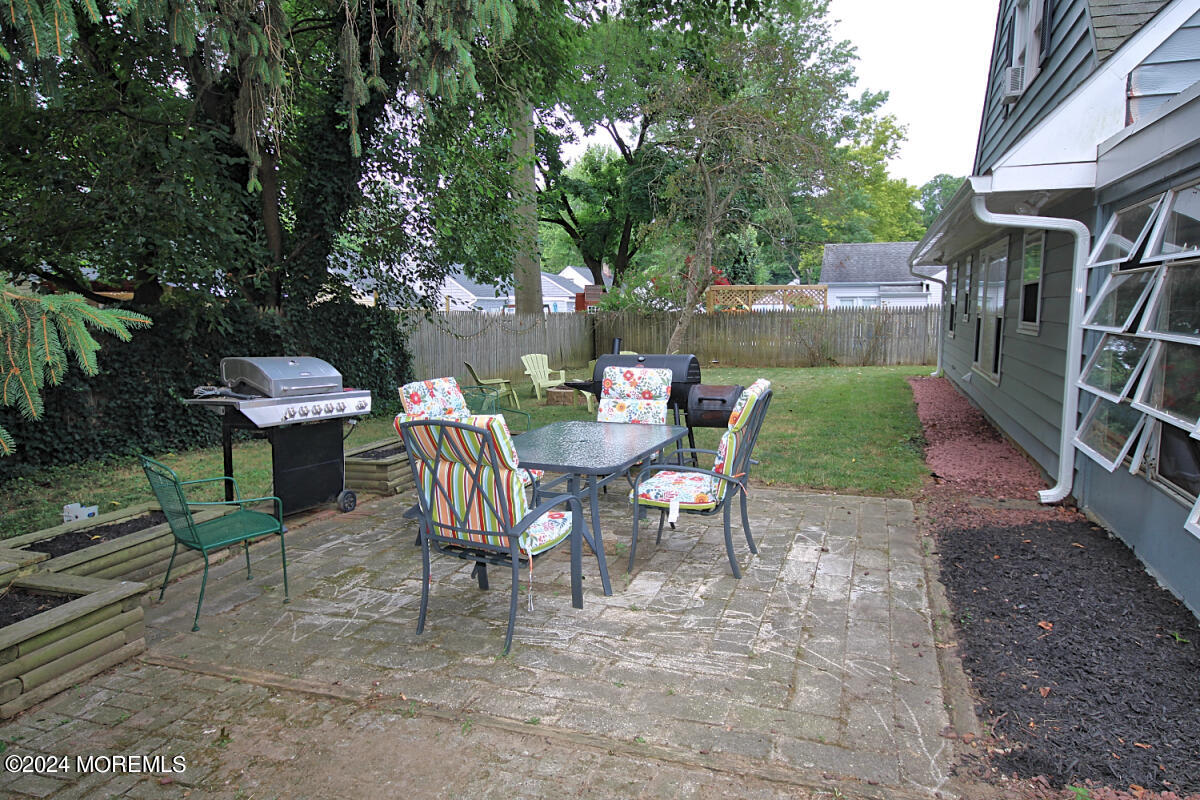 7 Taylor Road Matawan, NJ 07747 - Photo 26 of 33 a view of a chairs and table in backyard
