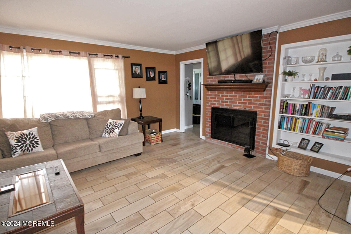 7 Taylor Road Matawan, NJ 07747 - Photo 3 of 33 a living room with furniture and a fireplace