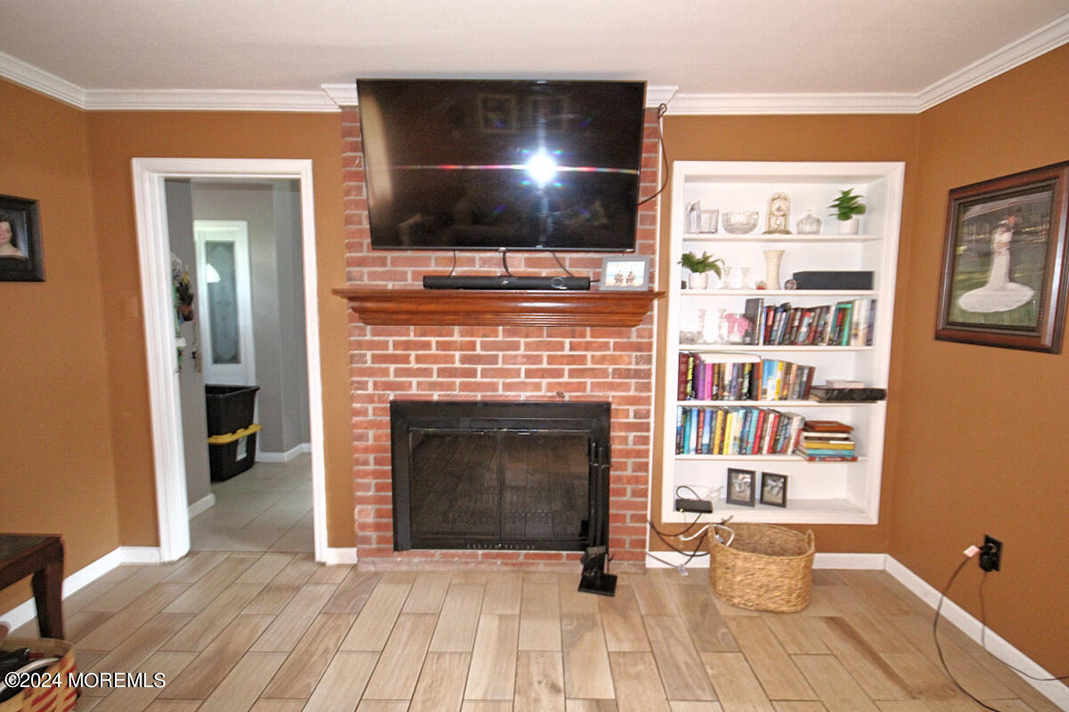 7 Taylor Road Matawan, NJ 07747 - Photo 4 of 33 a living room with furniture and a fireplace