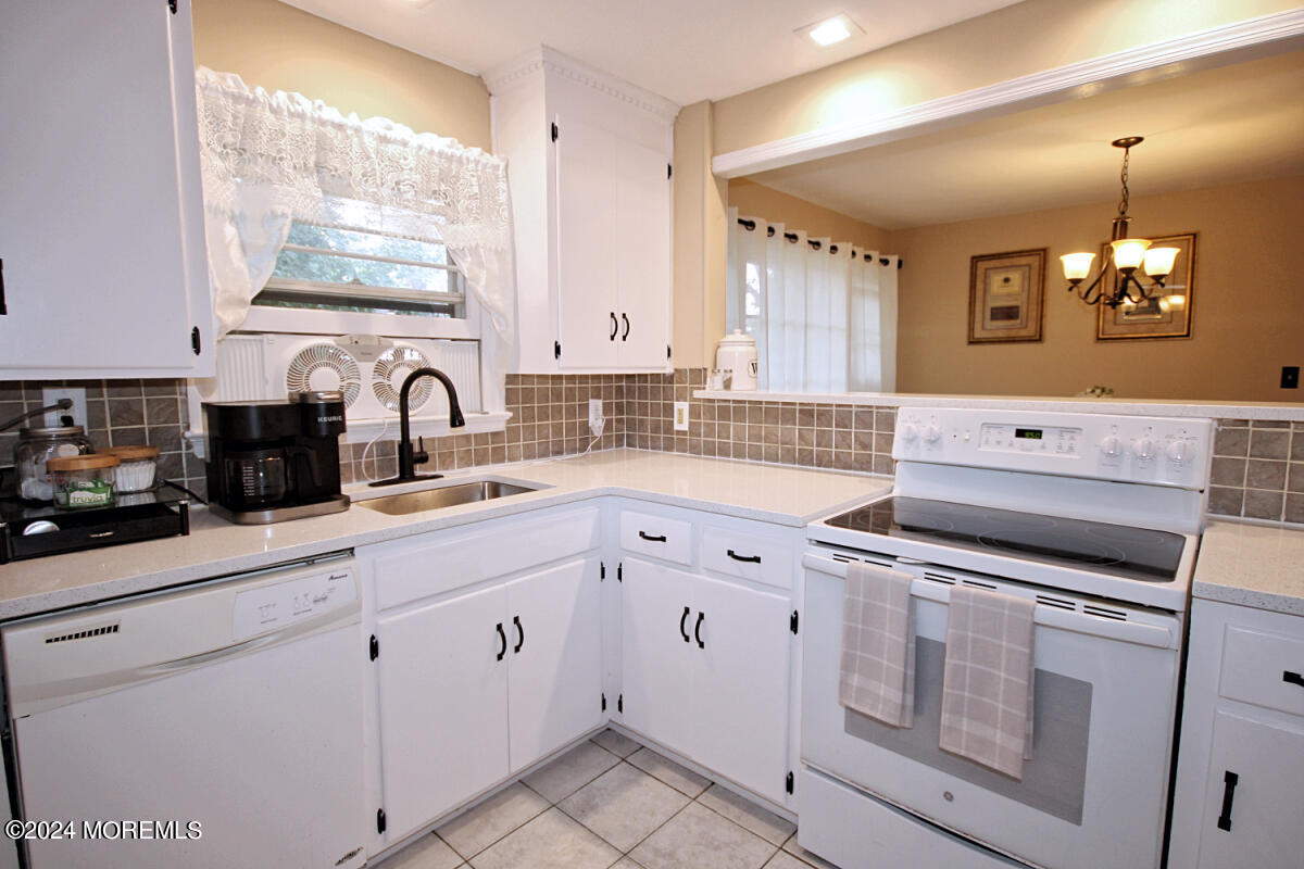 7 Taylor Road Matawan, NJ 07747 - Photo 7 of 33 a kitchen with granite countertop a sink stainless steel appliances and cabinets