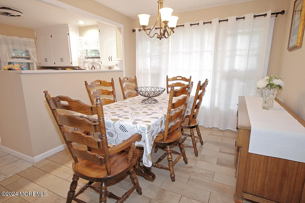 7 Taylor Road Matawan, NJ 07747 - Photo 9 of 33 a view of a dining room with furniture and a chandelier