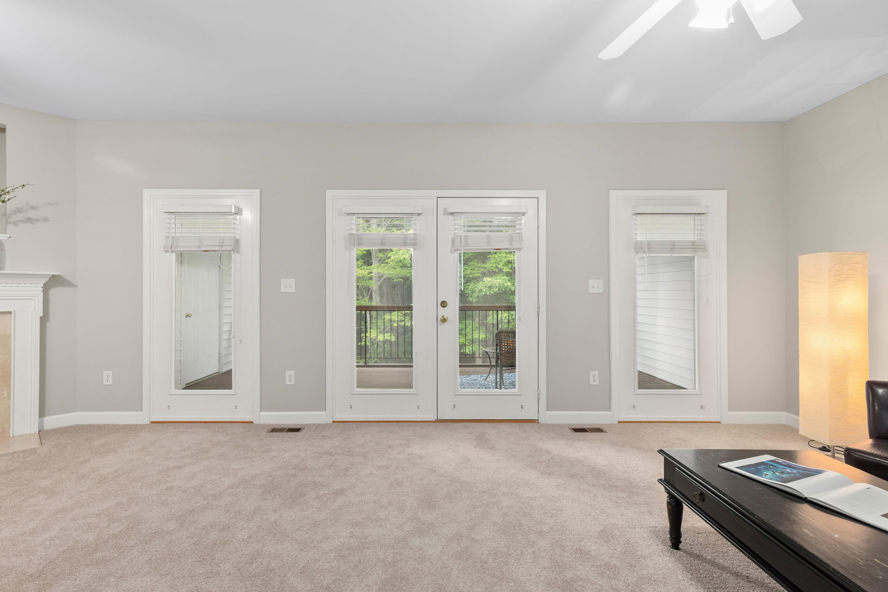 4546 Mistiflower Drive Raleigh, NC 27606 - Photo 12 of 34 3 large windows and a door leading to the screened back door. Go ahead and leave the door open to feel the breeze come in! For privacy, there are full length blinds on all. Great Room