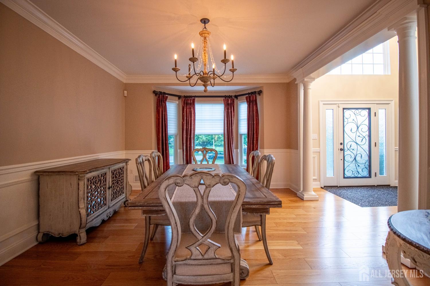 9 Pondview Drive Tinton Falls, NJ 07724 - Photo 10 of 41 a view of a dining room with furniture window and wooden floor