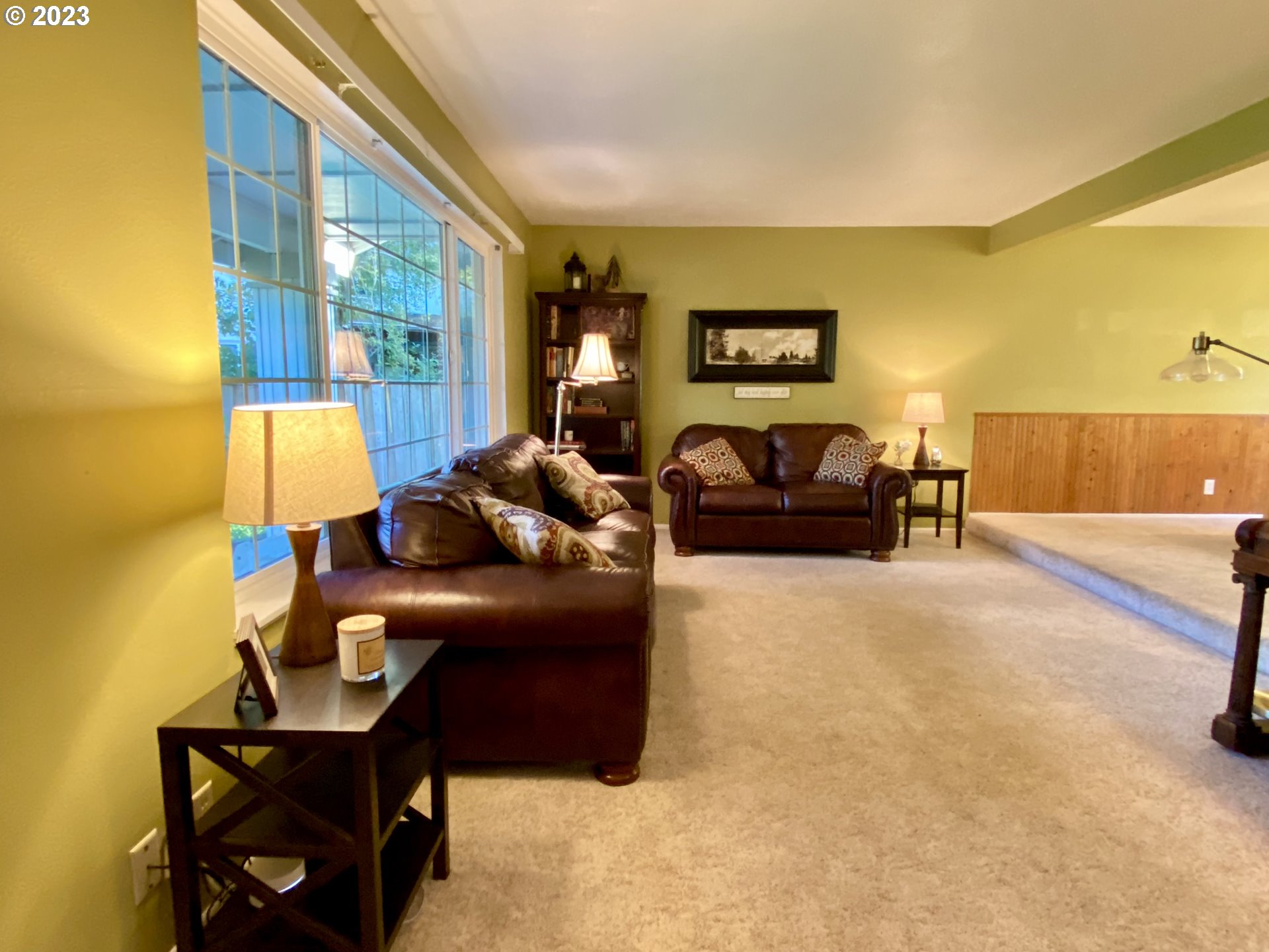 6566 E Street Springfield, OR 97478 - Photo 18 of 46 a living room with furniture and a flat screen tv