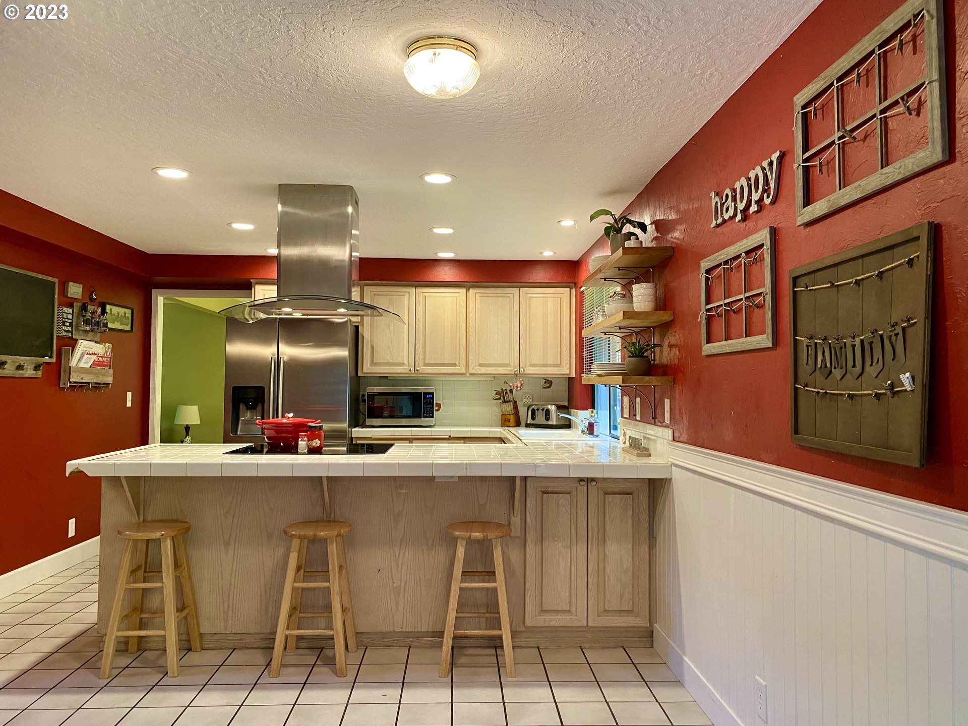 6566 E Street Springfield, OR 97478 - Photo 22 of 46 a kitchen with stainless steel appliances kitchen island granite countertop a sink and cabinets