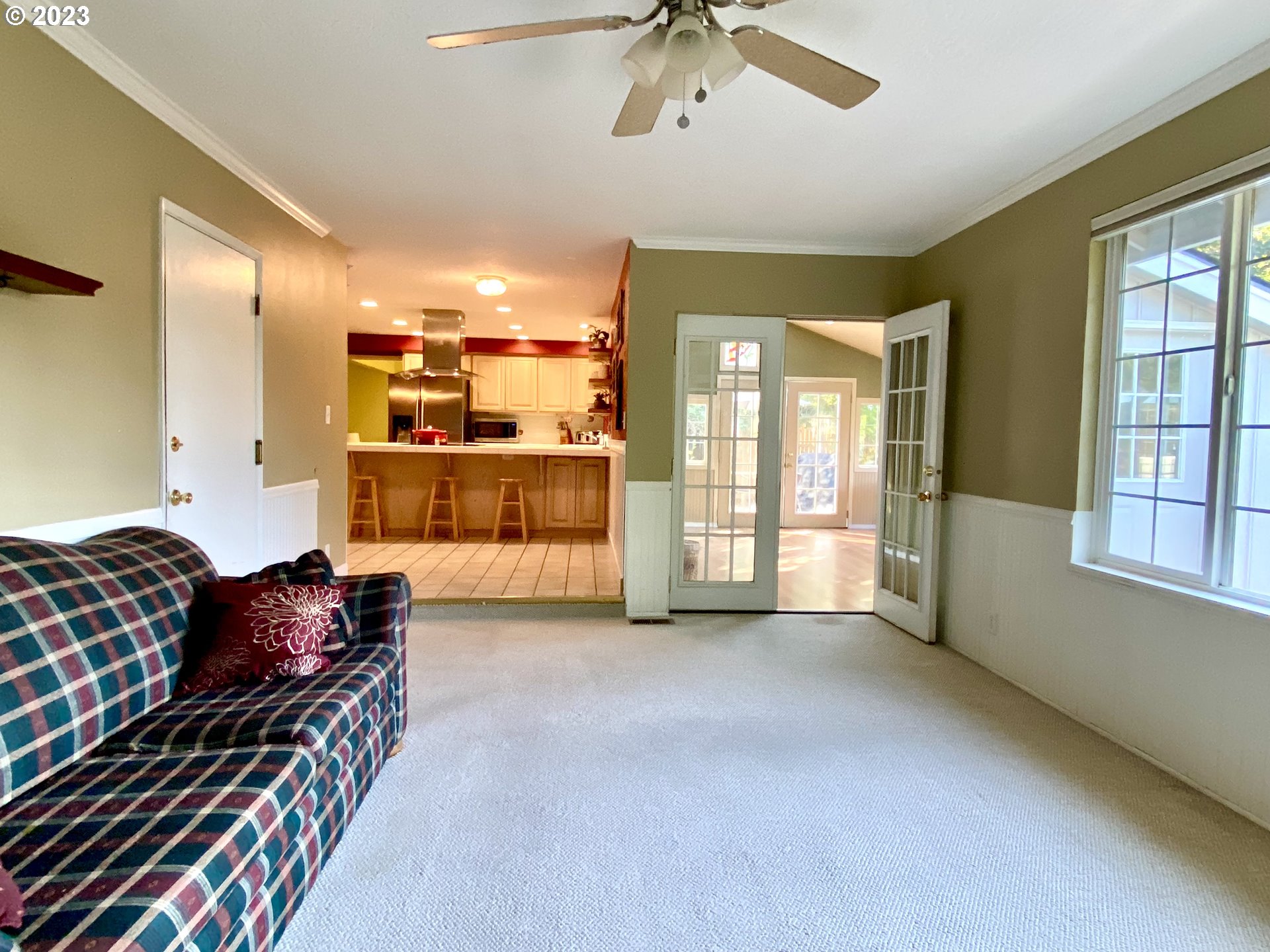 6566 E Street Springfield, OR 97478 - Photo 28 of 46 a living room with furniture and a chandelier