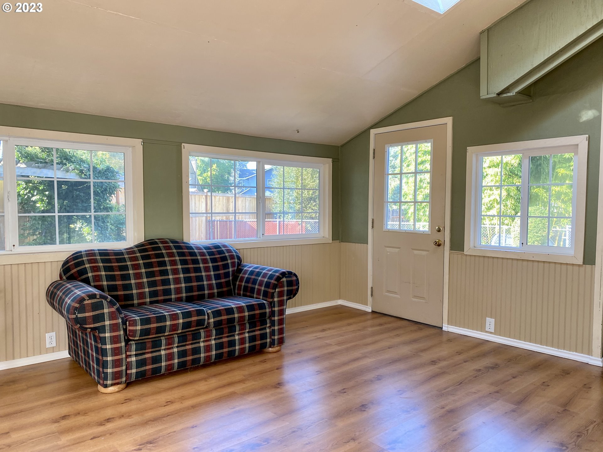 6566 E Street Springfield, OR 97478 - Photo 33 of 46 a bedroom with wooden floor and windows