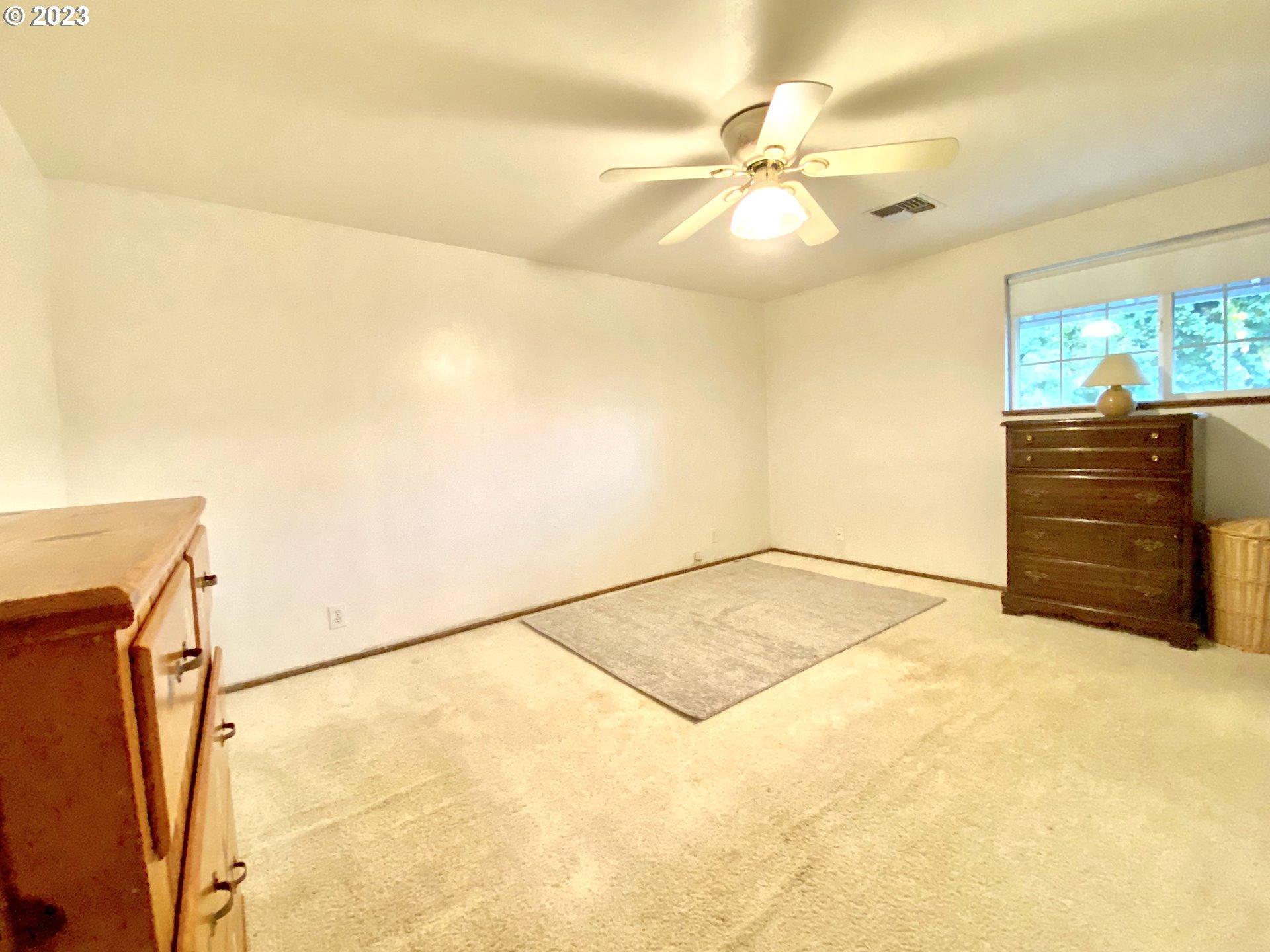 6566 E Street Springfield, OR 97478 - Photo 41 of 46 a view of a room with cabinet and a ceiling fan
