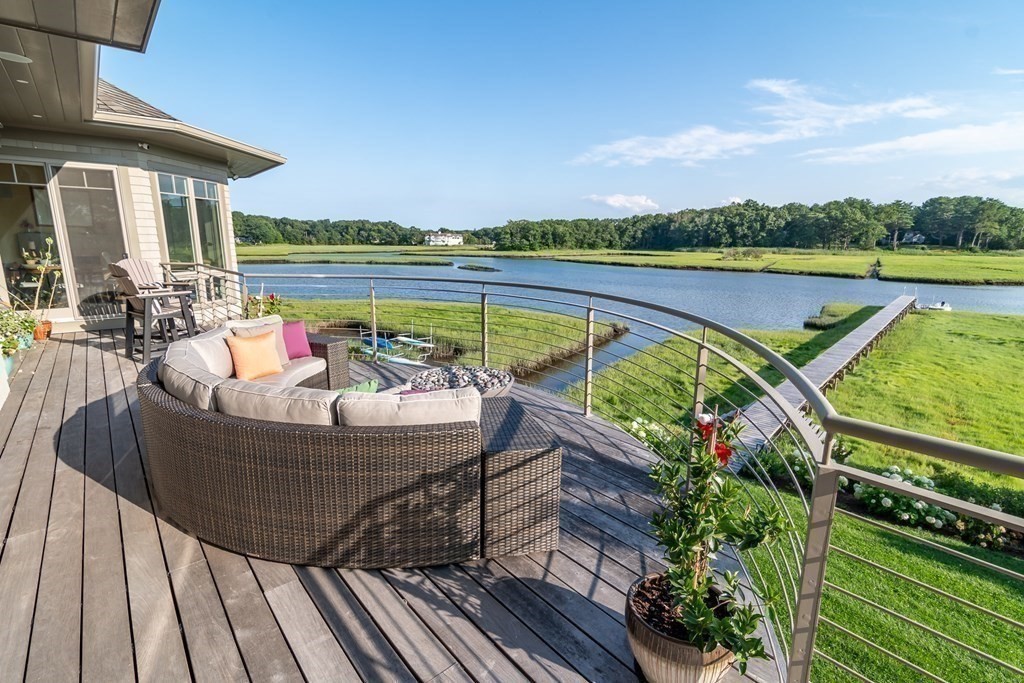 67 Border Street Scituate, MA 02066 - Photo 13 of 42 an outdoor sitting area with furniture and lake view