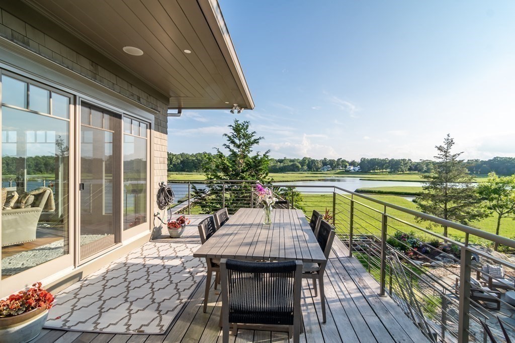 67 Border Street Scituate, MA 02066 - Photo 14 of 42 a view of a balcony with lake view and wooden floor