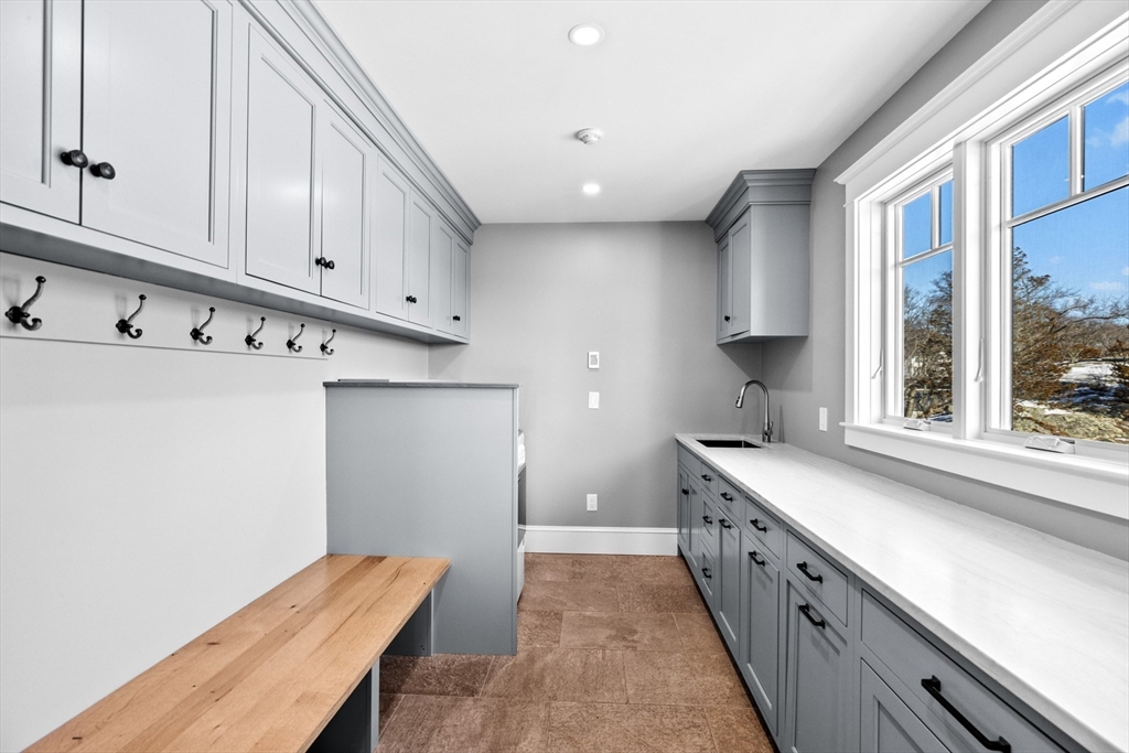 67 Border Street Scituate, MA 02066 - Photo 15 of 42 a kitchen with sink cabinets and window