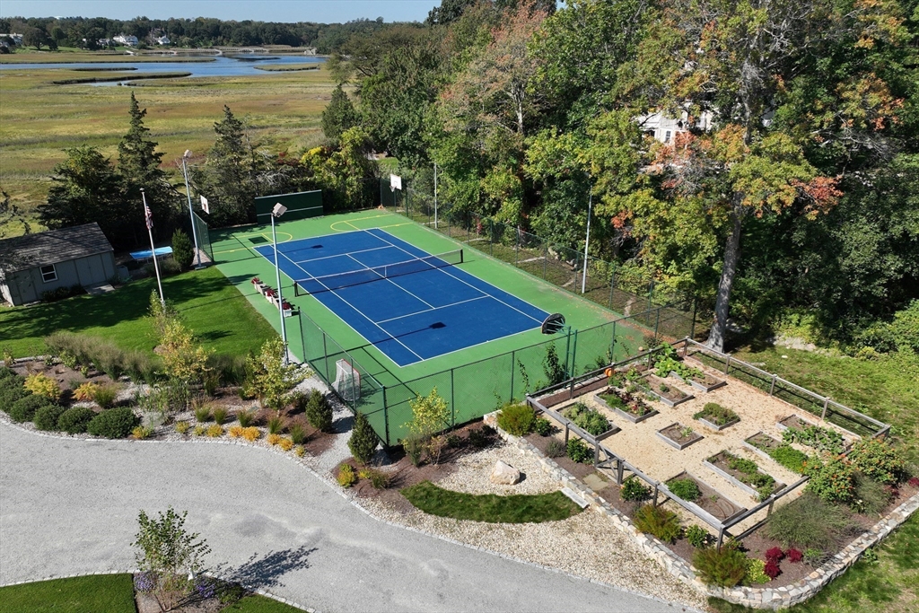 67 Border Street Scituate, MA 02066 - Photo 38 of 42 a view of a backyard with plants and lake view