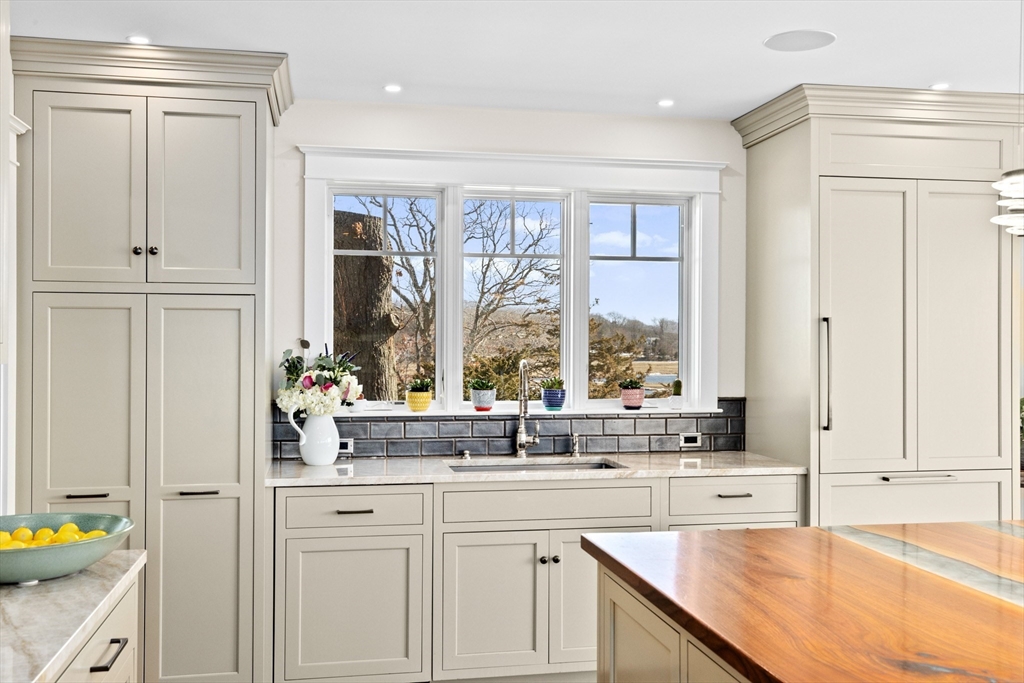 67 Border Street Scituate, MA 02066 - Photo 4 of 42 a view of a kitchen counter space with wooden floor and cabinet