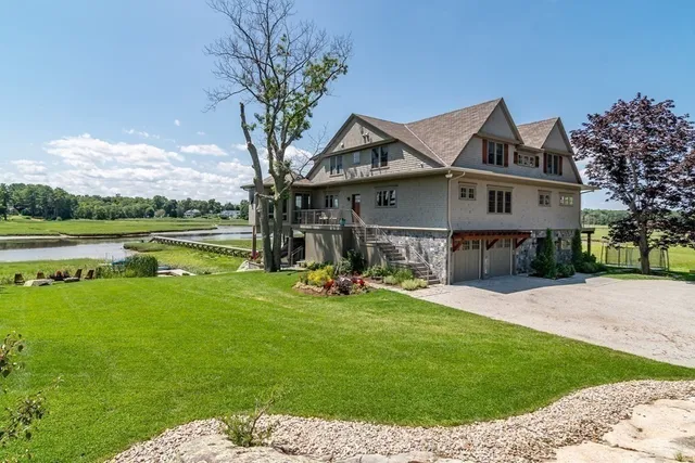 a front view of a house with yard