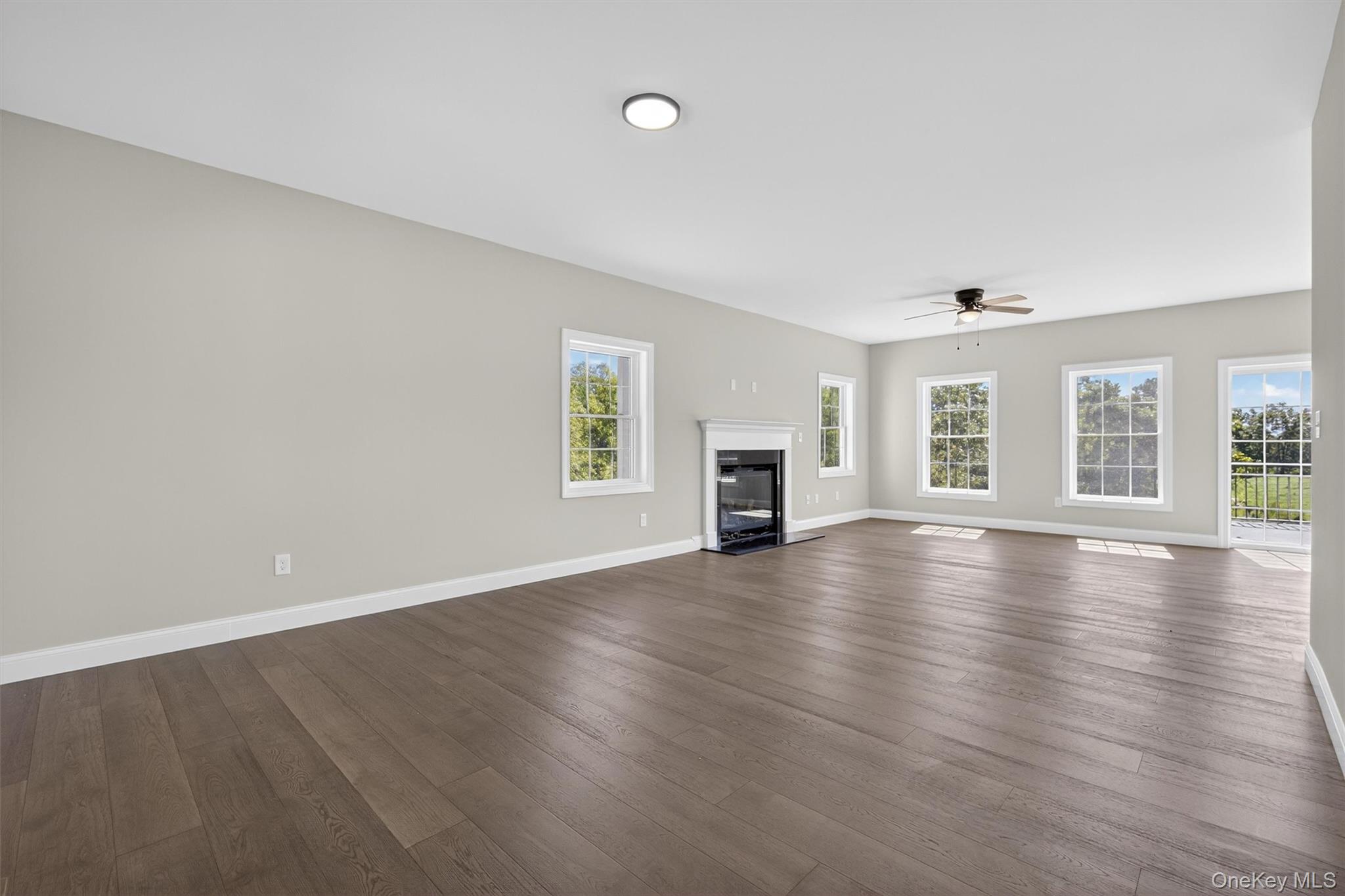 Lot 4 Kings Hill Road Walden, NY 12586 - Photo 13 of 34 an empty room with wooden floor and windows