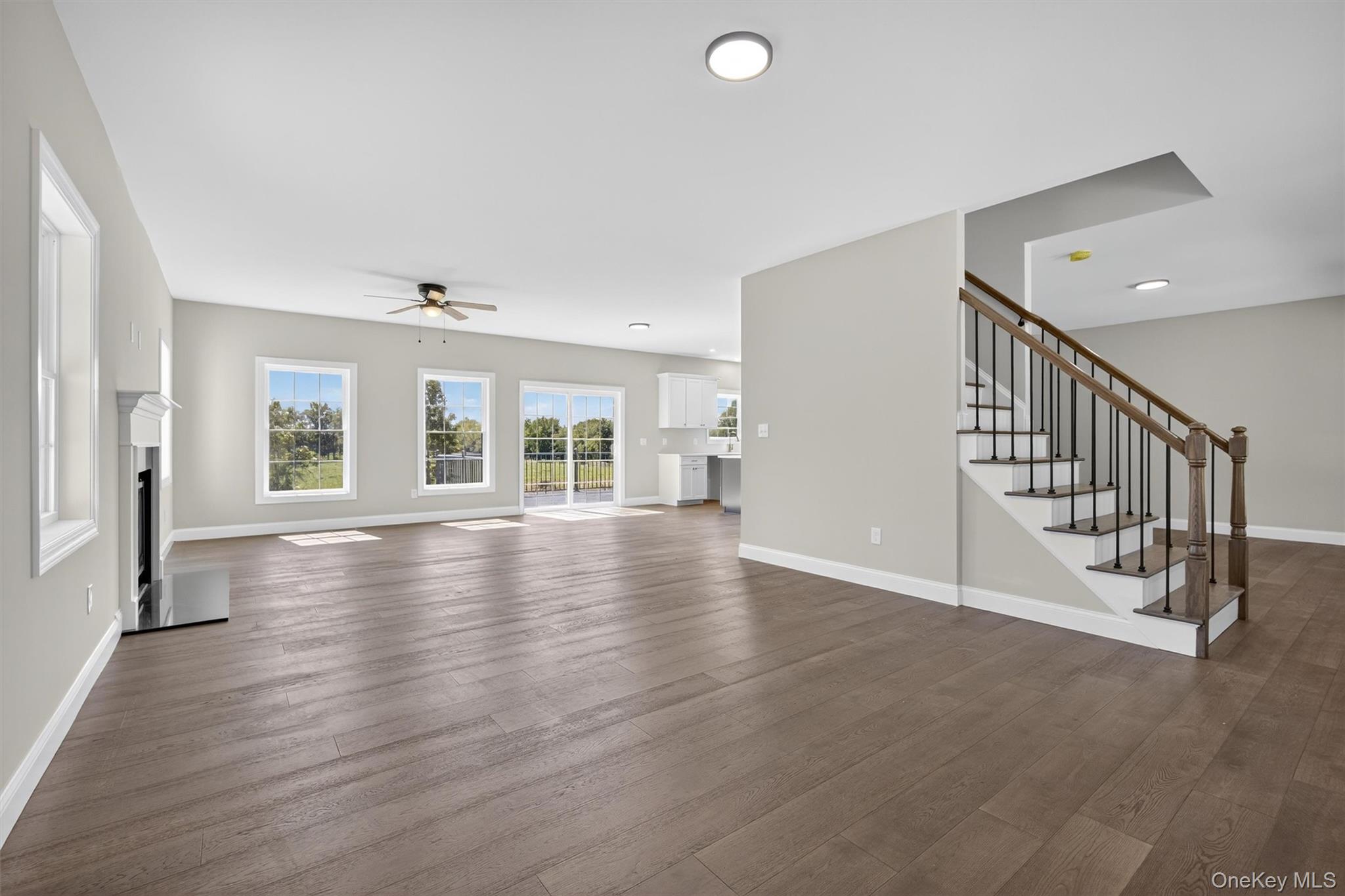Lot 4 Kings Hill Road Walden, NY 12586 - Photo 14 of 34 an empty room with wooden floor and windows