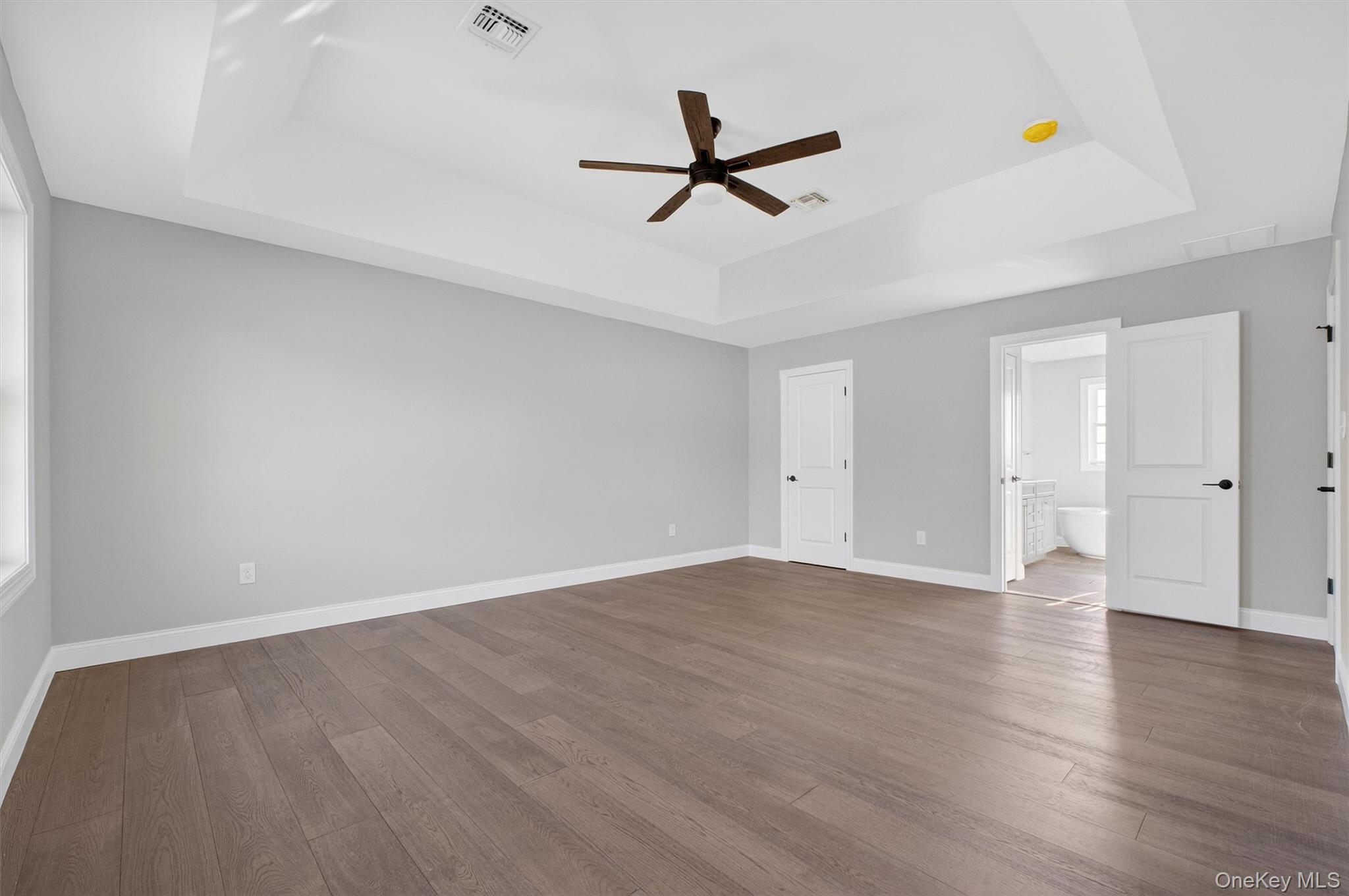 Lot 4 Kings Hill Road Walden, NY 12586 - Photo 18 of 34 an empty room with wooden floor and windows
