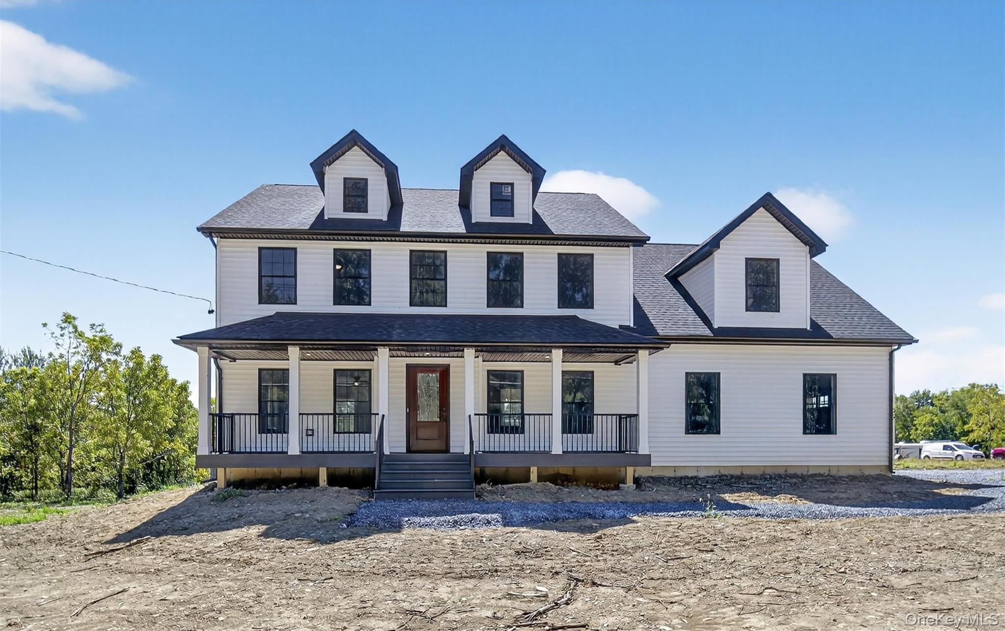 Lot 4 Kings Hill Road Walden, NY 12586 - Photo 2 of 34 a view of a white house with large windows next to a yard