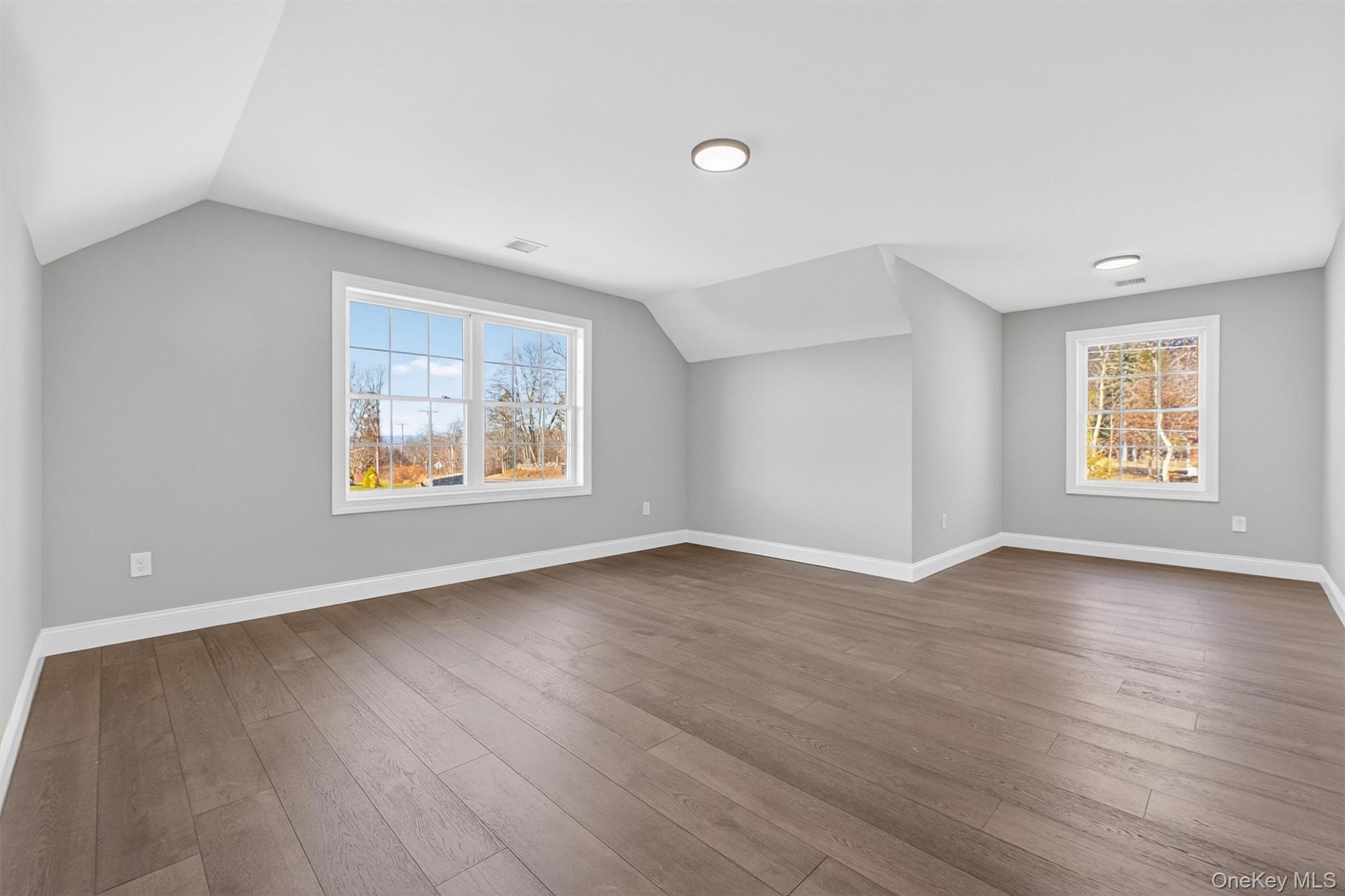 Lot 4 Kings Hill Road Walden, NY 12586 - Photo 23 of 34 an empty room with wooden floor and windows