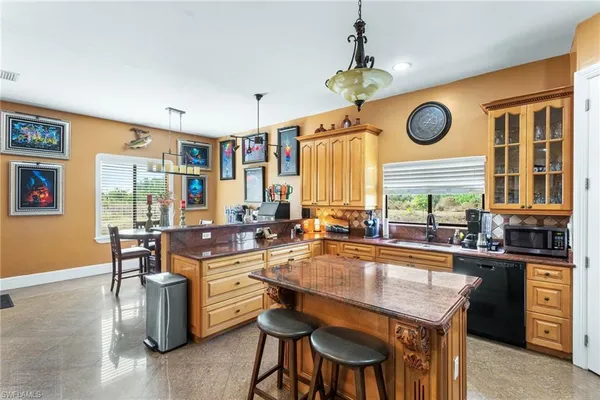 a dining table with chairs and window