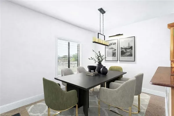 a view of a dining room with furniture and window