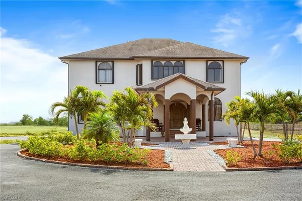a view of a house with a park