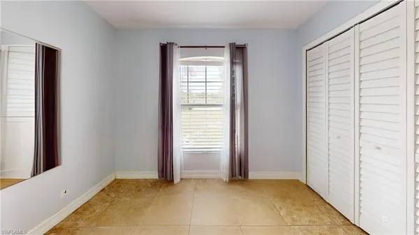 a bathroom with a sink a toilet and shower curtain