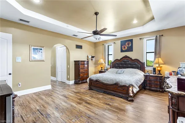 a bedroom with a bed dresser and a window