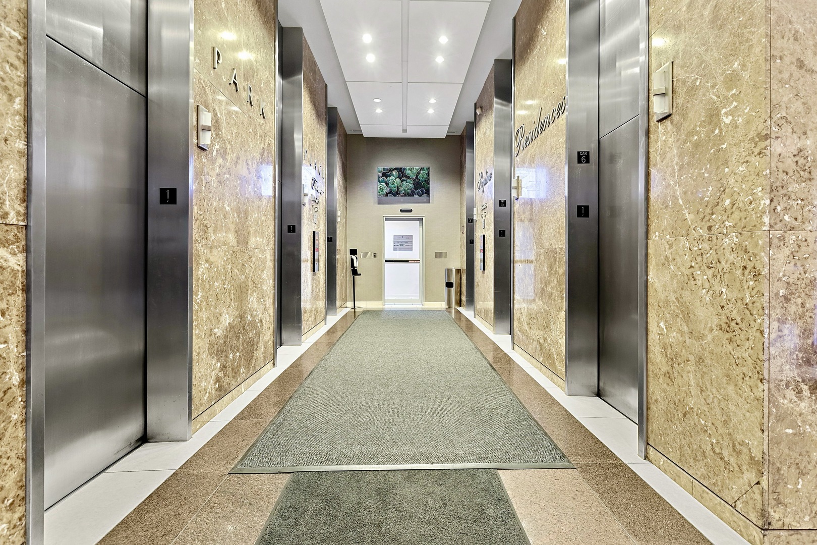 655 West Irving Park Road, Unit 4617 Chicago, IL 60613 - Photo 17 of 33 a view of a hallway with a glass door shower