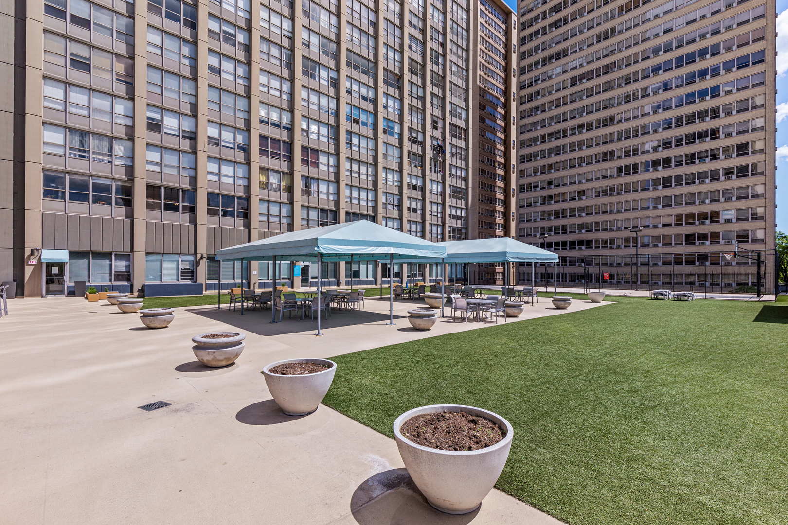 655 West Irving Park Road, Unit 4617 Chicago, IL 60613 - Photo 28 of 33 a view of a swimming pool and lounge chairs