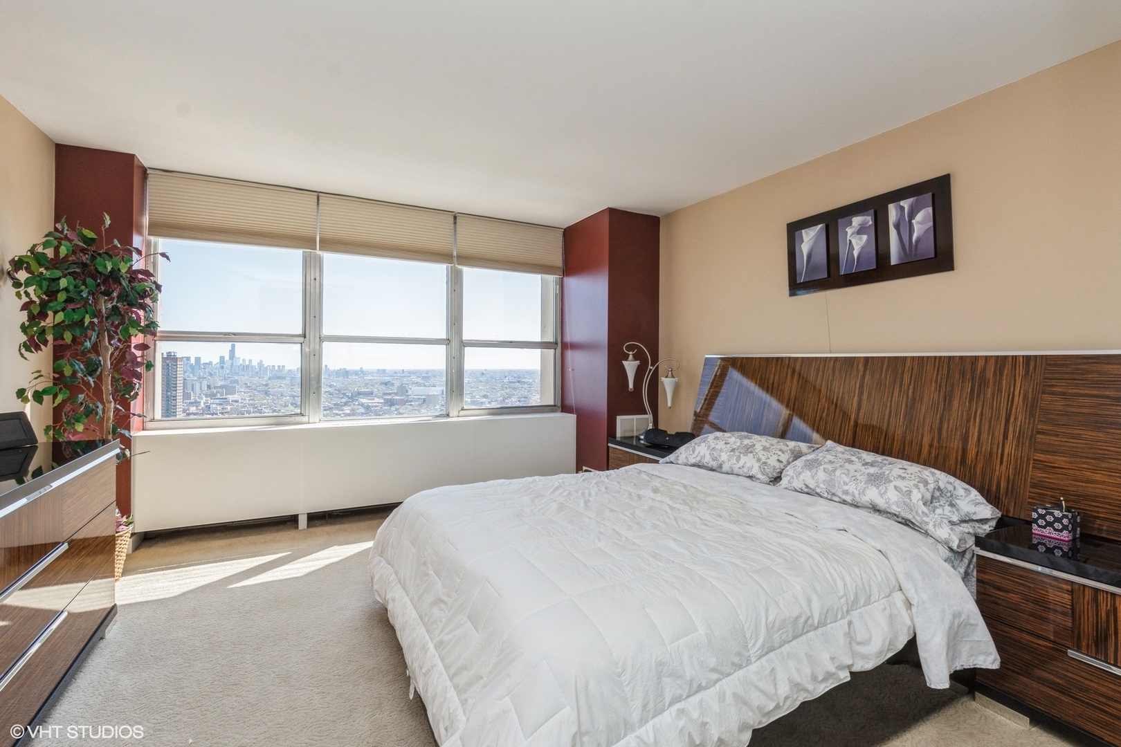 655 West Irving Park Road, Unit 4617 Chicago, IL 60613 - Photo 10 of 33 a bedroom with a large bed and a large window