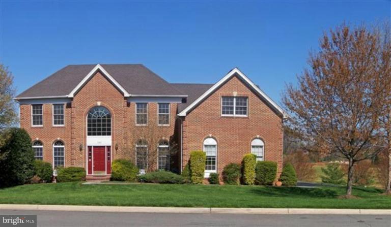 1307 Dasher Lane Reston, VA 20190 - Photo 1 of 29 a front view of a house with a garden
