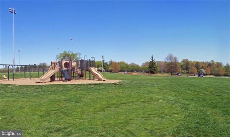 1307 Dasher Lane Reston, VA 20190 - Photo 17 of 29 a view of a park with swings and slides